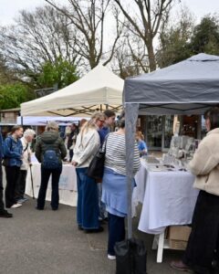 An Image Of A Previous Artisan Market At Cockington Court. The Image Is Of Gazebos With People Walking Around To Look.