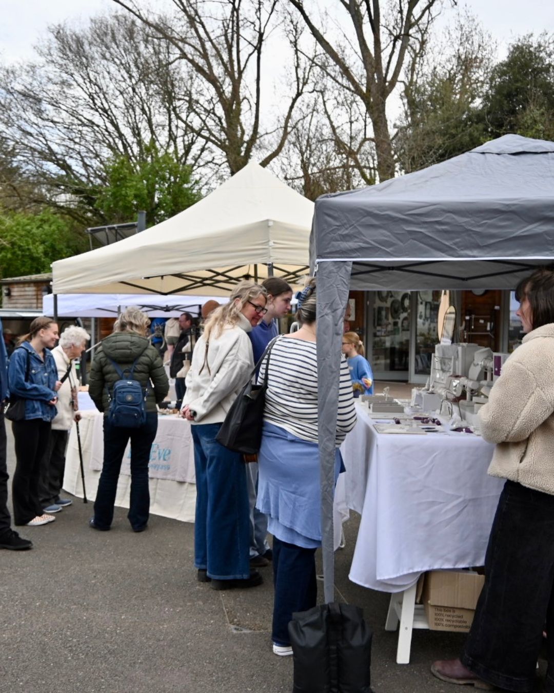 An Image Of A Previous Artisan Market At Cockington Court. The Image Is Of Gazebos With People Walking Around To Look.